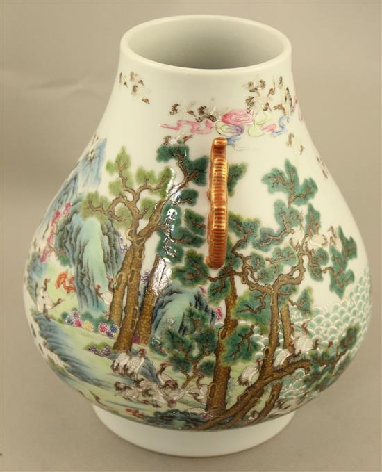 A Chinese famille verte pear shaped vase, Hu, 21cm